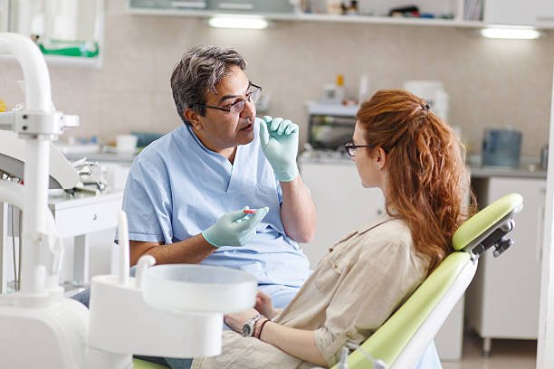 dentist patient preoperative consultation talking