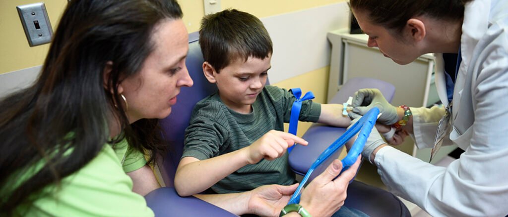 child tablet distraction hospital medical procedure